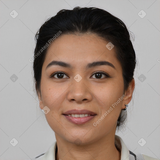 Joyful latino young-adult female with medium  black hair and brown eyes