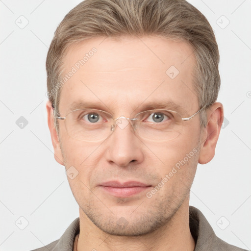 Joyful white adult male with short  brown hair and grey eyes