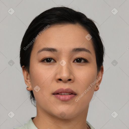 Joyful asian young-adult female with short  black hair and brown eyes