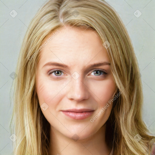 Joyful white young-adult female with long  brown hair and blue eyes