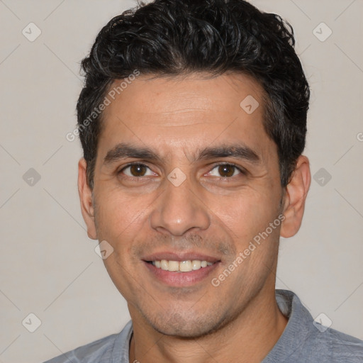 Joyful white young-adult male with short  black hair and brown eyes