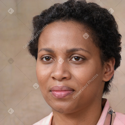 Joyful black adult female with short  brown hair and brown eyes