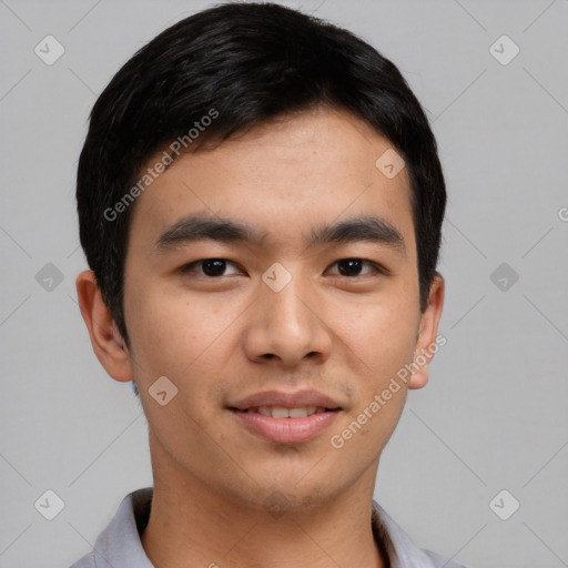 Joyful asian young-adult male with short  black hair and brown eyes