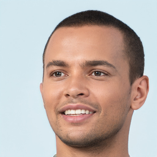 Joyful white young-adult male with short  black hair and brown eyes