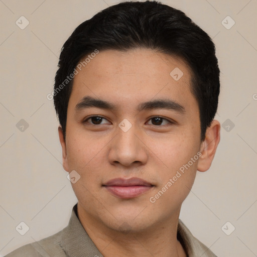 Joyful latino young-adult male with short  black hair and brown eyes