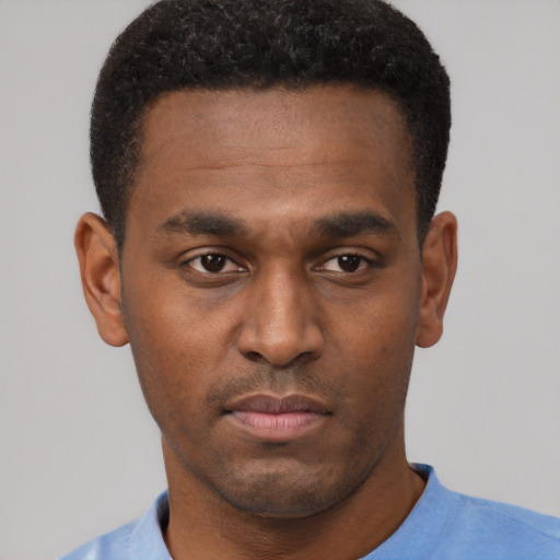 Neutral black young-adult male with short  brown hair and brown eyes