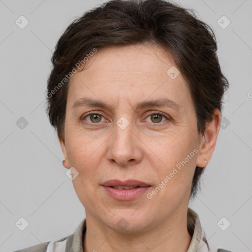 Joyful white adult female with short  brown hair and brown eyes