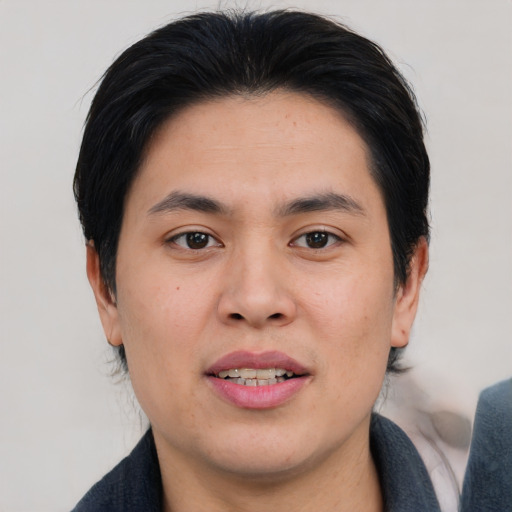 Joyful asian young-adult male with medium  brown hair and brown eyes
