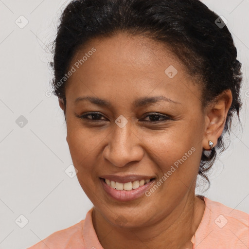 Joyful latino adult female with short  brown hair and brown eyes