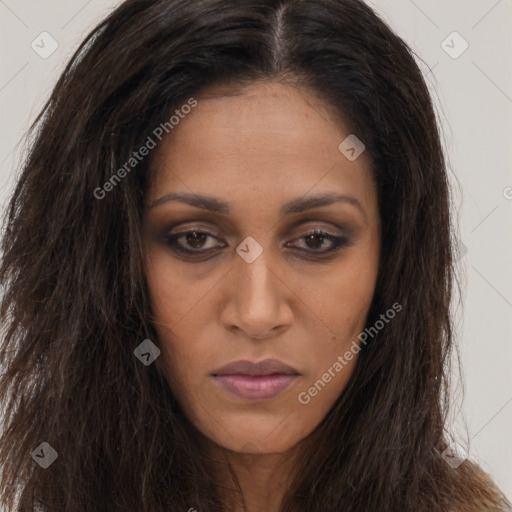 Joyful black young-adult female with long  brown hair and brown eyes