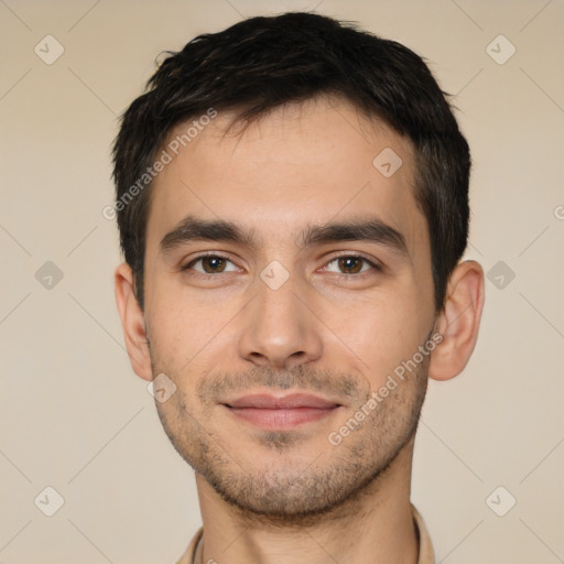 Joyful white young-adult male with short  black hair and brown eyes