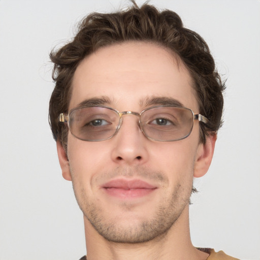 Joyful white adult male with short  brown hair and grey eyes