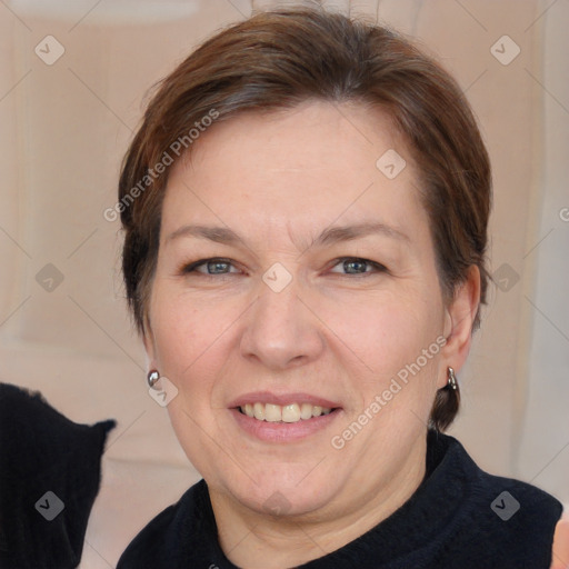 Joyful white adult female with medium  brown hair and brown eyes