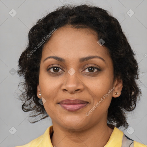 Joyful black adult female with medium  brown hair and brown eyes