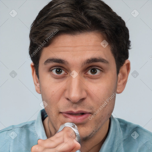 Neutral white young-adult male with short  brown hair and brown eyes