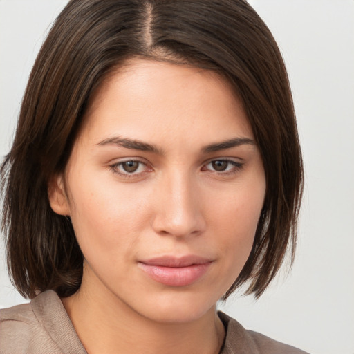 Neutral white young-adult female with medium  brown hair and brown eyes