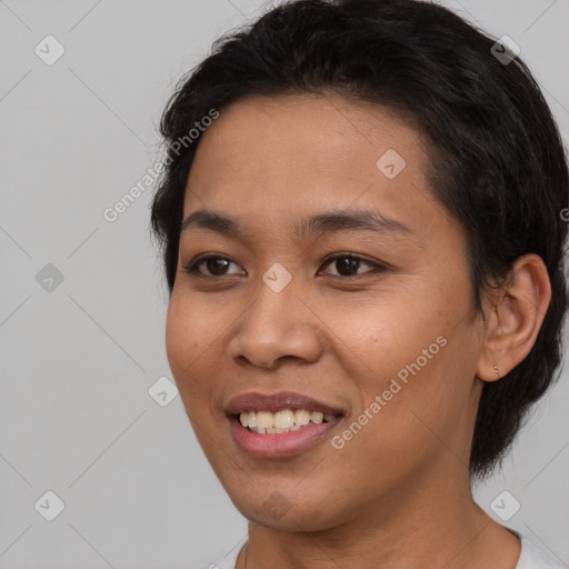 Joyful latino young-adult female with short  black hair and brown eyes