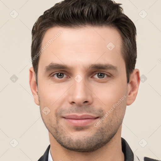 Joyful white young-adult male with short  brown hair and brown eyes