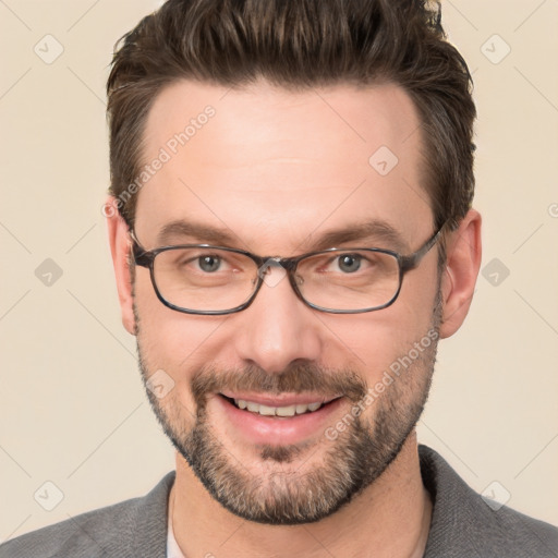 Joyful white adult male with short  brown hair and brown eyes