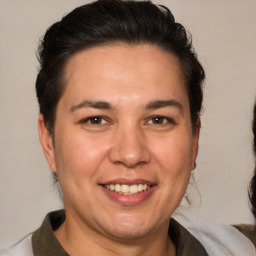 Joyful white adult male with medium  brown hair and brown eyes