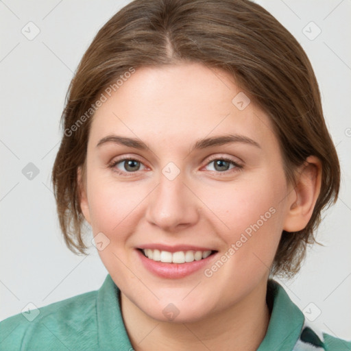 Joyful white young-adult female with medium  brown hair and blue eyes