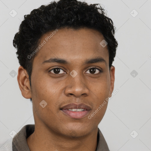 Joyful black young-adult male with short  brown hair and brown eyes