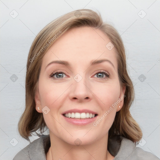 Joyful white young-adult female with medium  brown hair and blue eyes