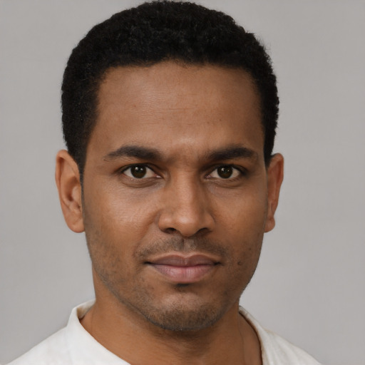 Neutral black young-adult male with short  black hair and brown eyes