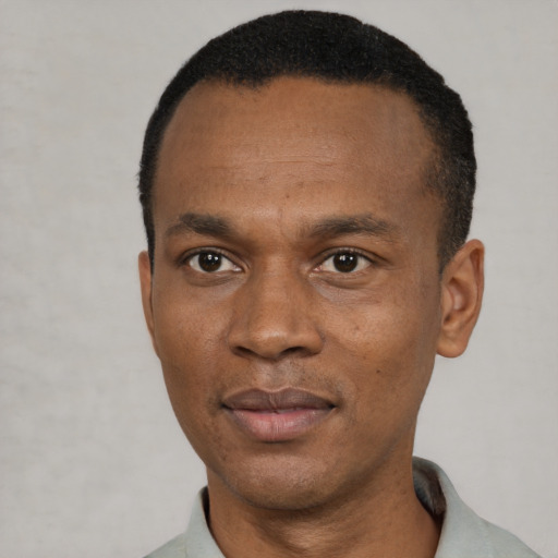 Neutral black adult male with short  black hair and brown eyes