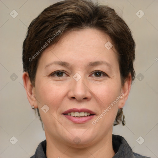 Joyful white adult female with short  brown hair and grey eyes