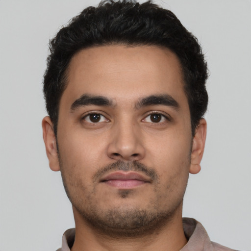 Neutral latino young-adult male with short  black hair and brown eyes