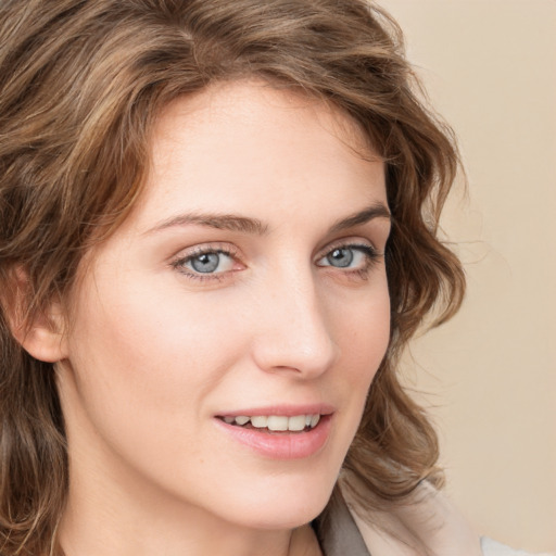 Joyful white young-adult female with medium  brown hair and blue eyes