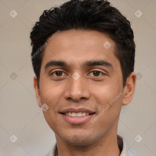 Joyful white young-adult male with short  black hair and brown eyes