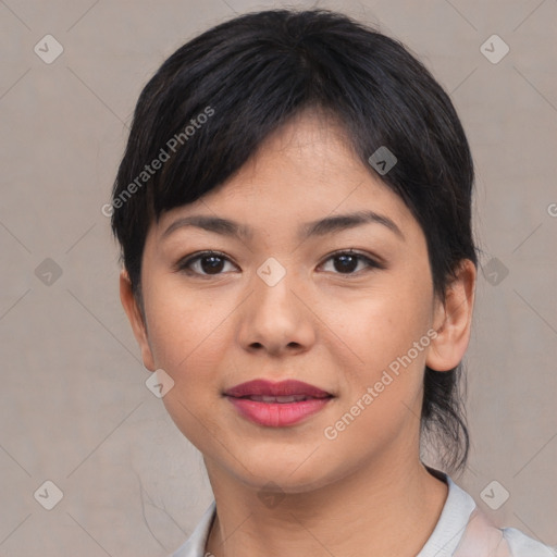 Joyful asian young-adult female with short  black hair and brown eyes