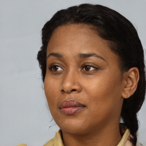 Neutral black adult female with short  black hair and brown eyes