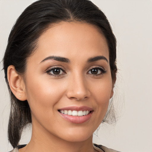 Joyful white young-adult female with medium  brown hair and brown eyes