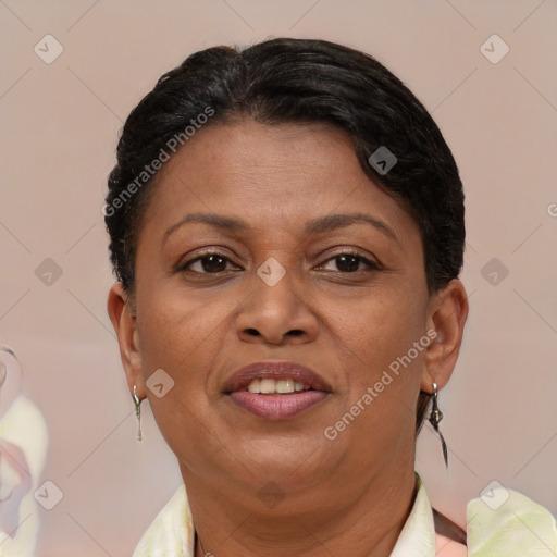 Joyful black adult female with short  brown hair and brown eyes