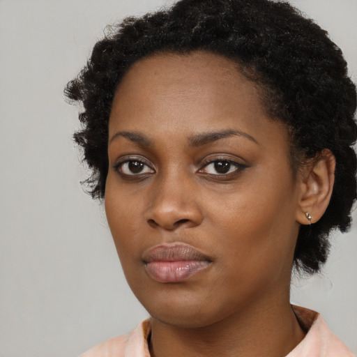 Neutral black young-adult female with short  black hair and brown eyes