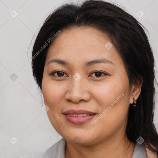 Joyful asian young-adult female with long  brown hair and brown eyes