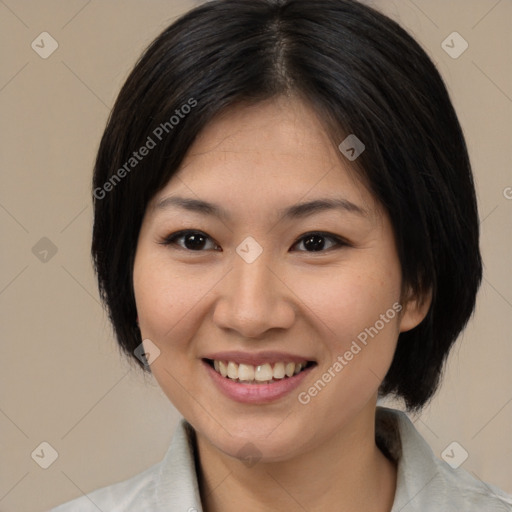 Joyful asian young-adult female with medium  black hair and brown eyes