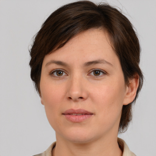 Joyful white young-adult female with medium  brown hair and brown eyes