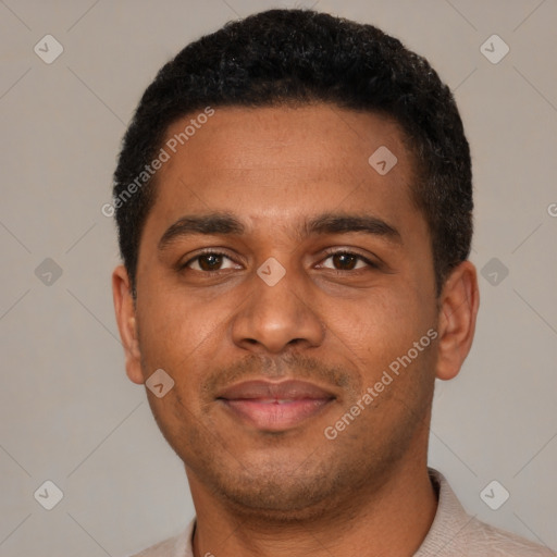 Joyful black young-adult male with short  black hair and brown eyes