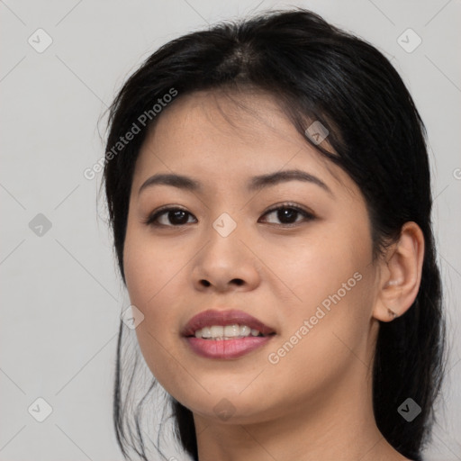 Joyful asian young-adult female with medium  brown hair and brown eyes