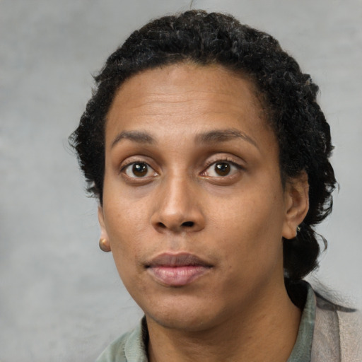 Neutral black adult female with short  black hair and brown eyes