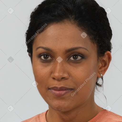 Joyful black young-adult female with short  brown hair and brown eyes