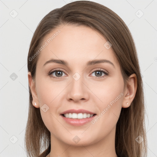 Joyful white young-adult female with long  brown hair and grey eyes