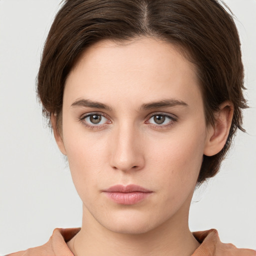 Neutral white young-adult female with short  brown hair and brown eyes