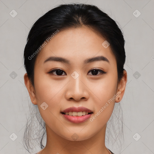 Joyful asian young-adult female with medium  black hair and brown eyes