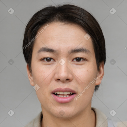 Joyful asian young-adult male with short  brown hair and brown eyes