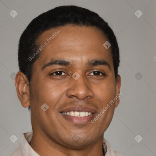 Joyful latino young-adult male with short  brown hair and brown eyes